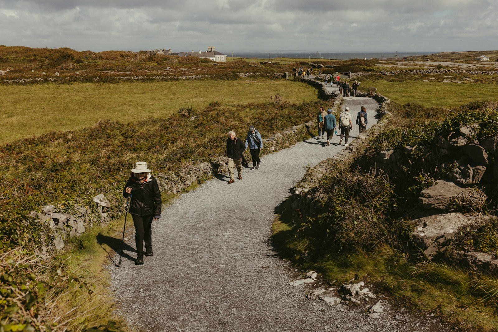 People walking on a scenic coastal path